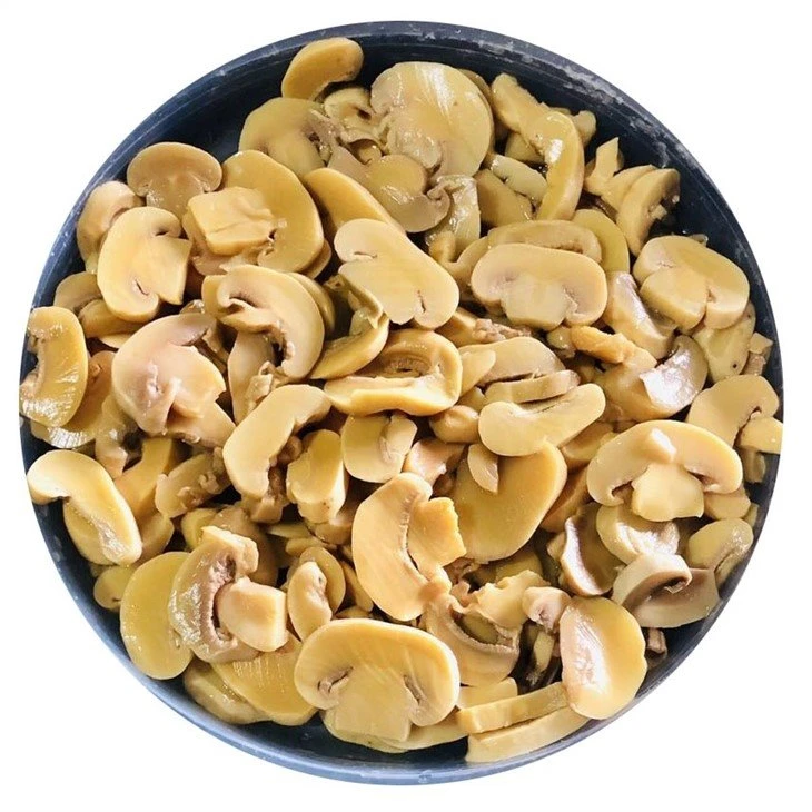 Preserved sliced white champignon mushroom in brine in drums