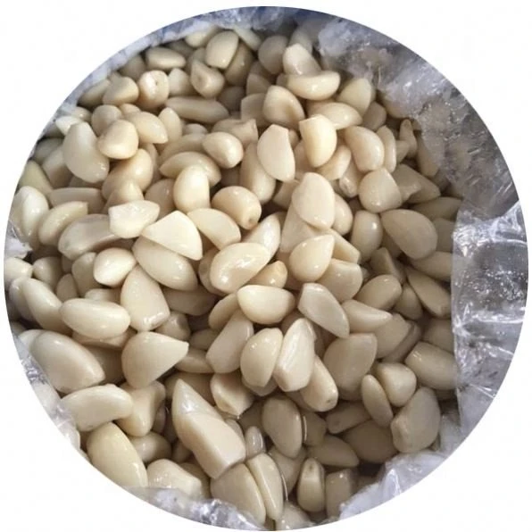 Salted garlic cloves in drums